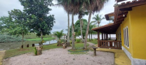 Charmosa Casa com 06 suítes na praia, beira rio Juqueriquere com rampa para barcos e jet sky